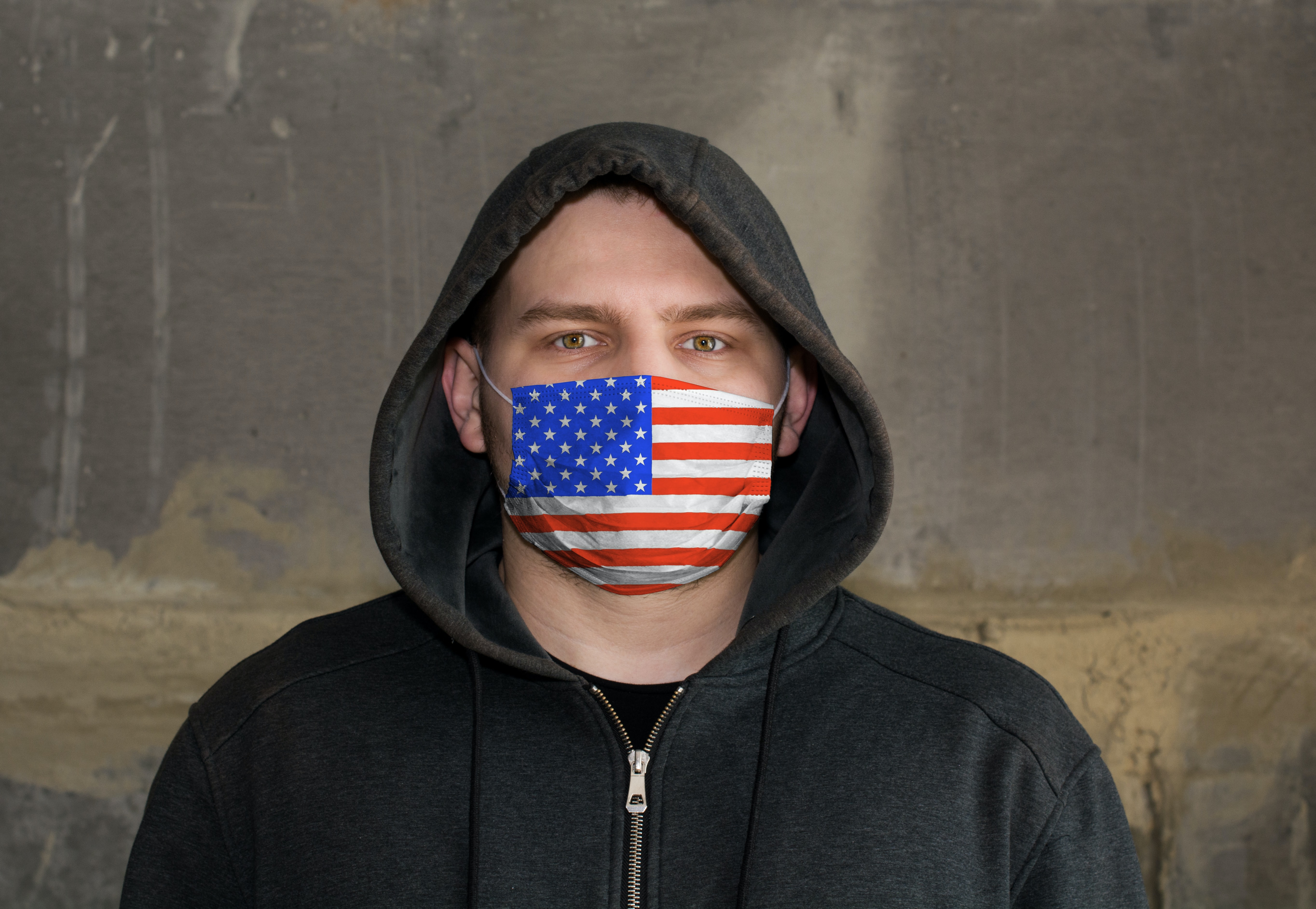 hooded man wearing US Flag mask Identifying Individuals in US Capitol Attack