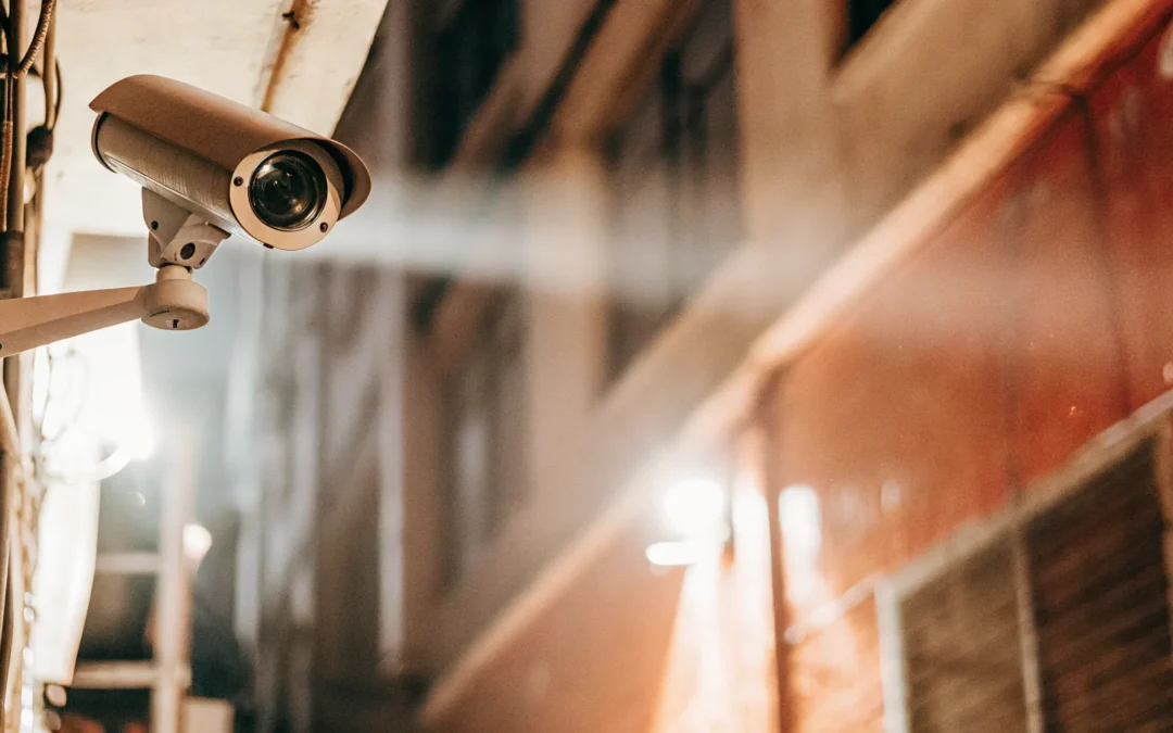 Gunshot detection system security camera on brick wall.