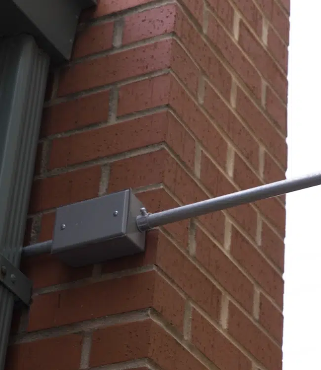 Security Assessment 5 Low-voltage conduit routed between commercial buildings during an Umbrella Security installation.