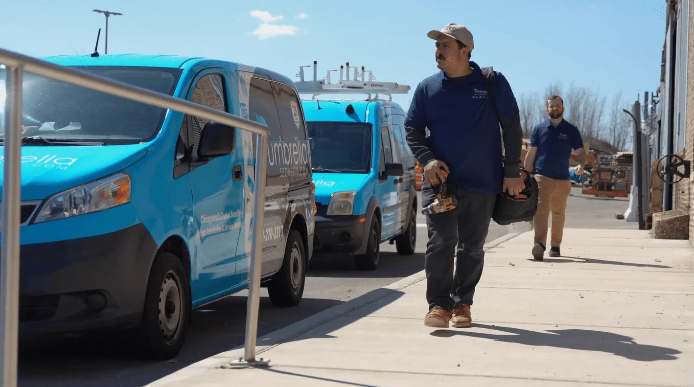 Umbrella Security Systems installation team on a commercial job site