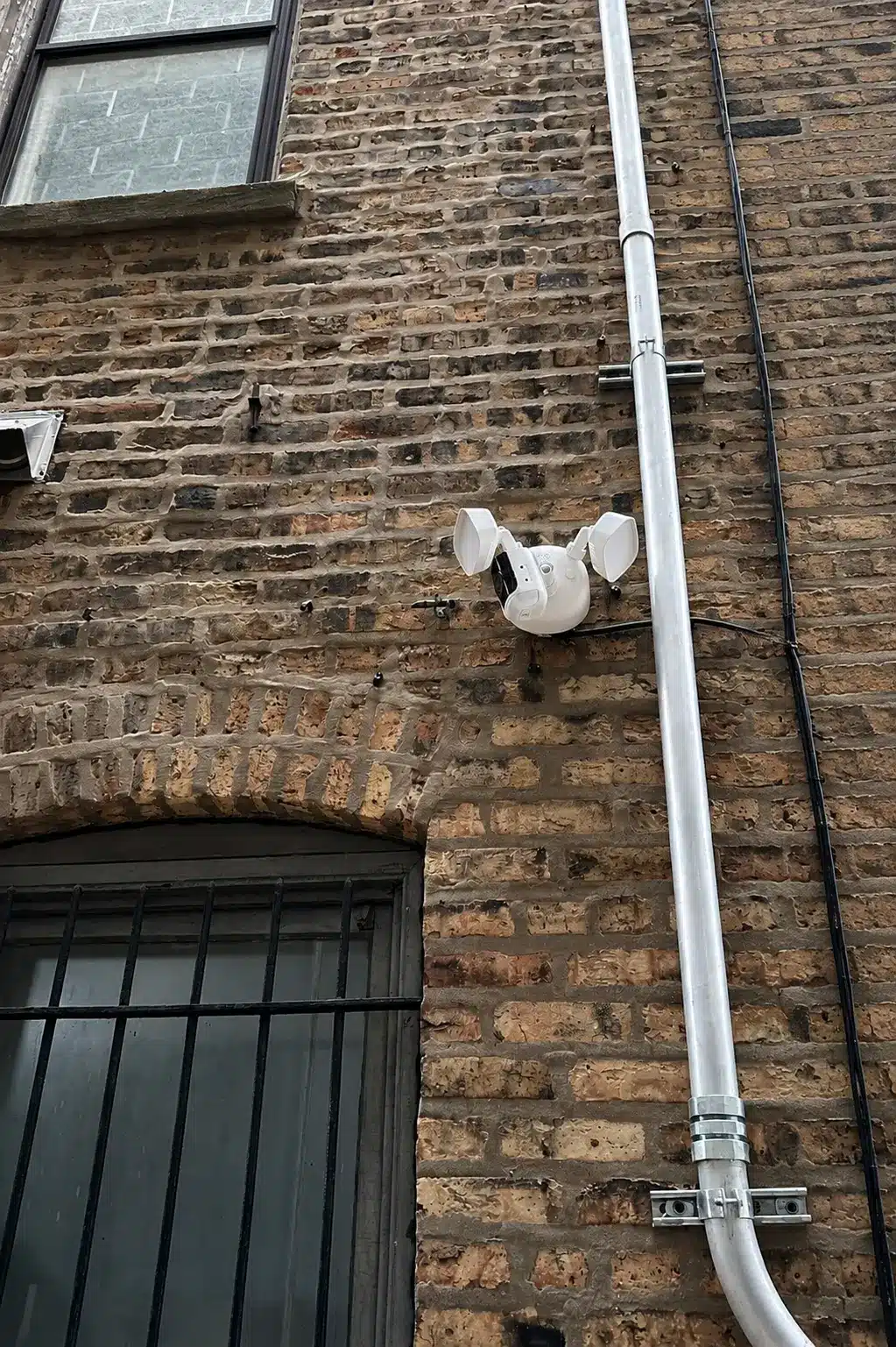 Alarm.com for Business Review 9 Floodlight security camera installed at a commercial exterior