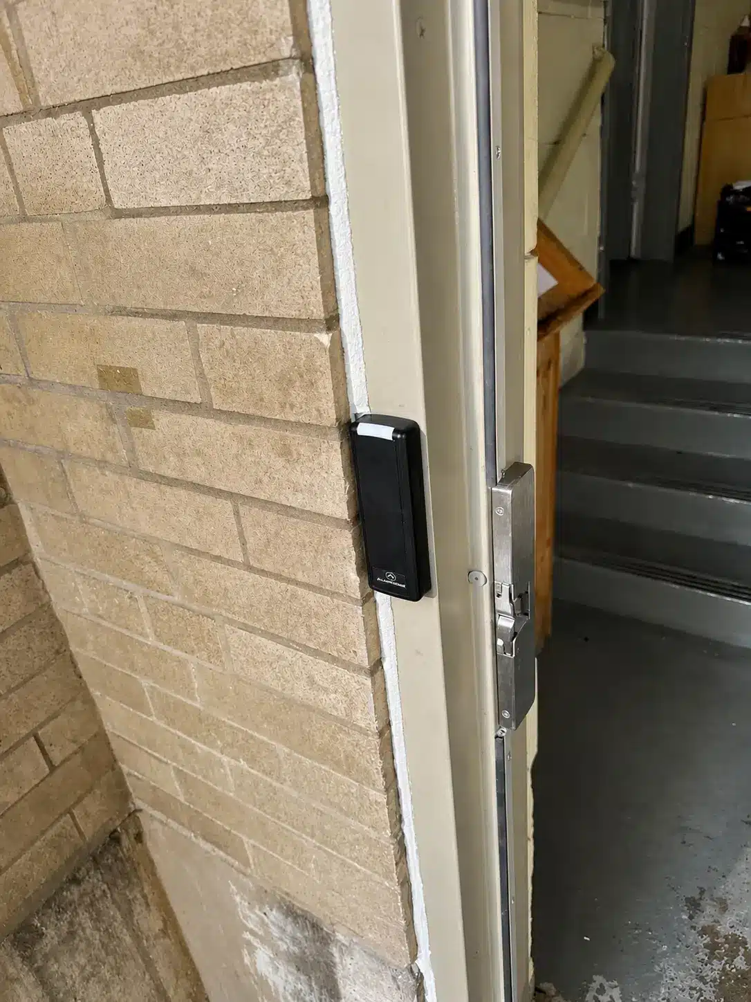 Alarm.com for Business Review 4 Proximity card reader installed on a commercial door mullion